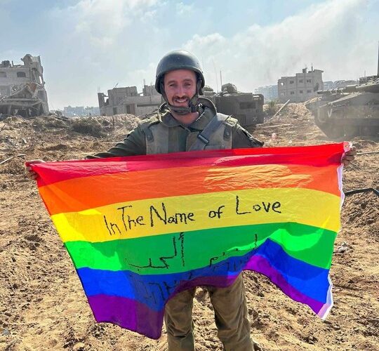 Gay Israeli Soldier Proudly Displays LGBTQ Flag On Gaza Soil