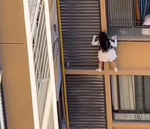 Mistress nearly plunges from 10th floor while escaping from lover’s wife
